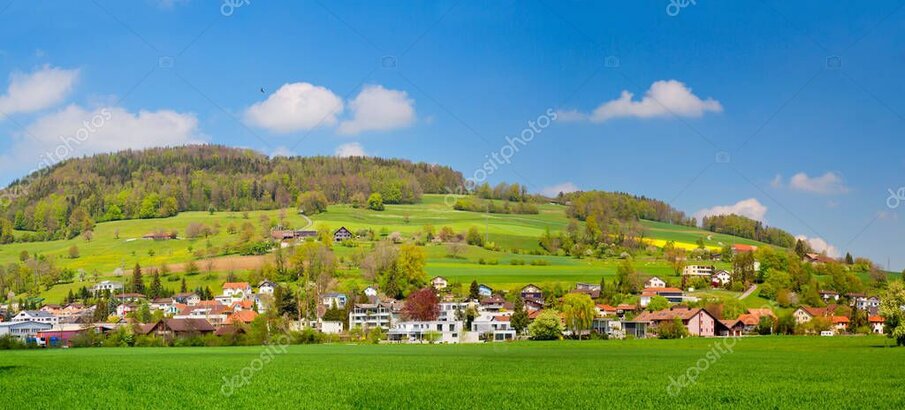 Traditional Swiss village by a mountain lake