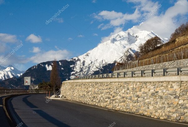 Swiss mountain road with traffic signs