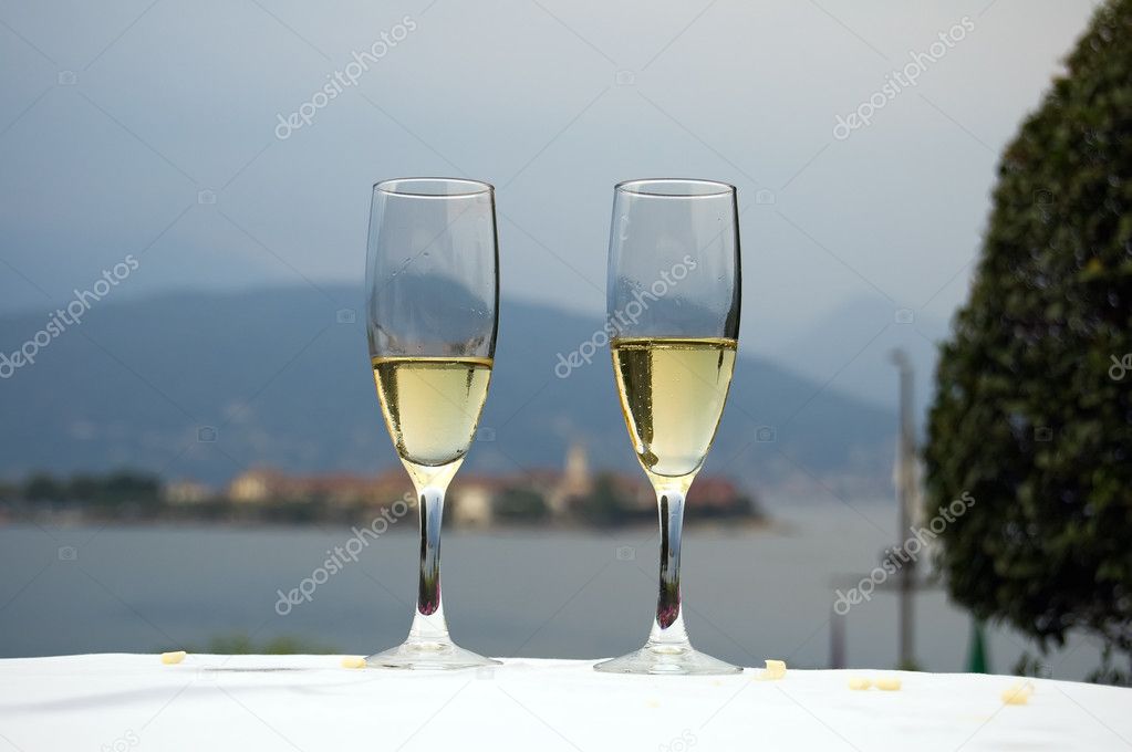 Couple enjoying a romantic lakeside hotel terrace