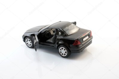 Mercedes SLK cruising along an alpine lakeside scenic road