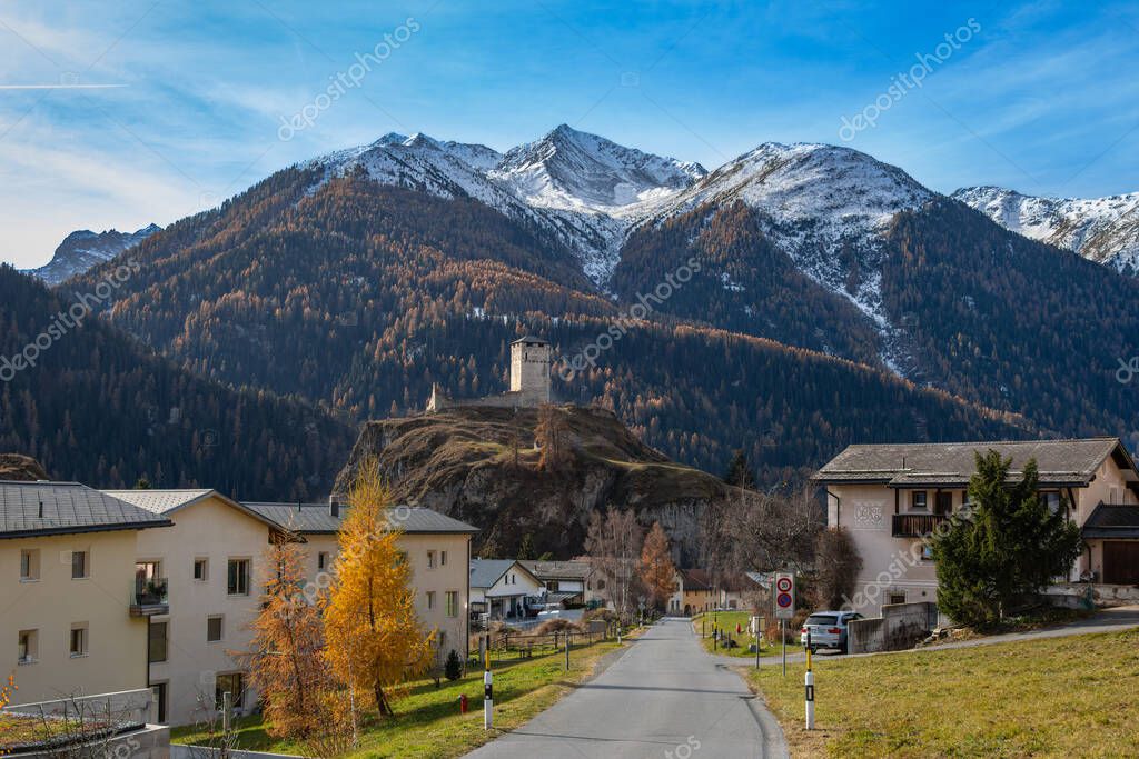 Cultural guide sharing stories with guests by a Swiss lake